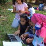 Rida Bayraktar, founder of PinkSTREAM (right), discusses code with students at the Scratch Coding Camp on May 15, 2018. Students worked on coding a character in Scratch, a programming language designed for kids, to perform a dance choreography they created together.