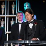 Theodore Kim accepts a Technical Achievement Award in 2012
