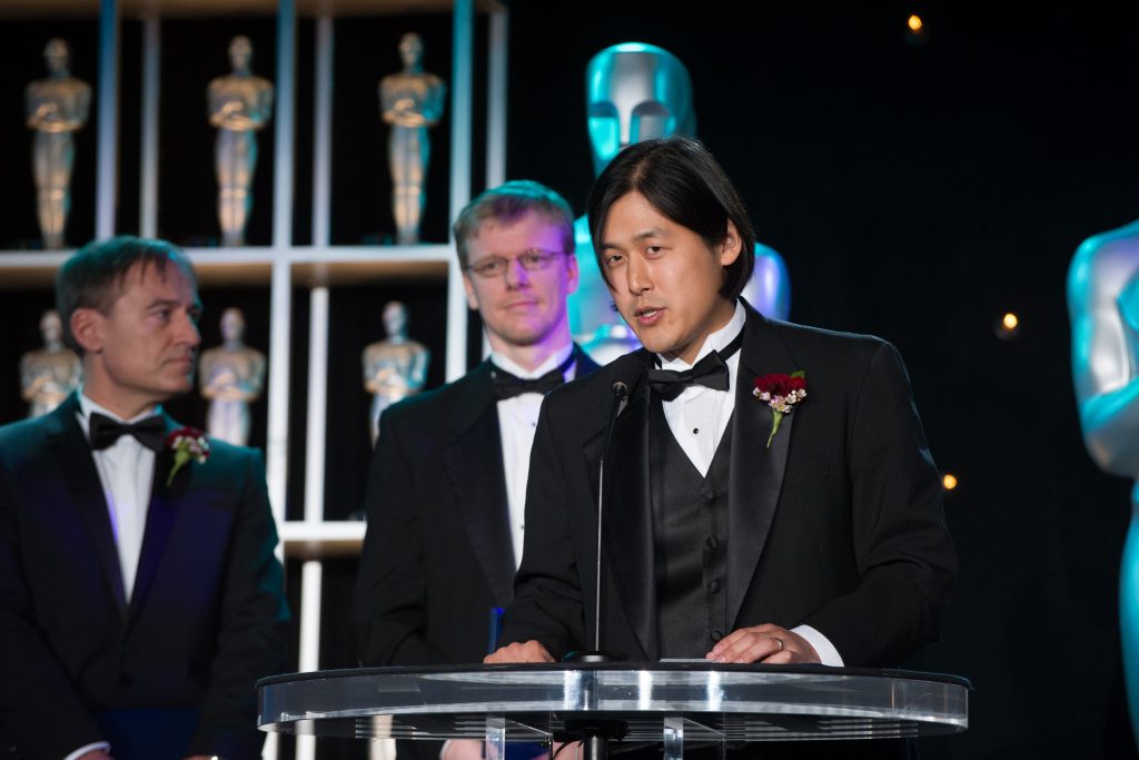 Theodore Kim accepts a Technical Achievement Award in 2012