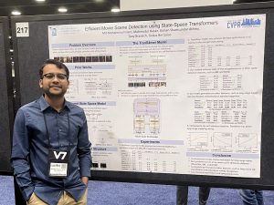 Md Mohaiminul Islam poses with a research poster for his paper “Efficient Movie Scene Detection Using State-Space Transformers” at CVPR 2023