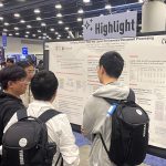 Zineng Tang presents a Highlight research poster to a crowd at CVPR 2023