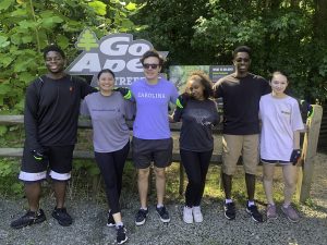 The 2023 UNC-Intel REU cohort poses for a photo at the Go Ape! zipline and adventure park in Raleigh, N.C.
