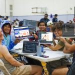 Competitors at HackNC 2023 show their work