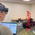 Doctoral student Jade Kandel observes an augmented reality visualization of a Parkinson